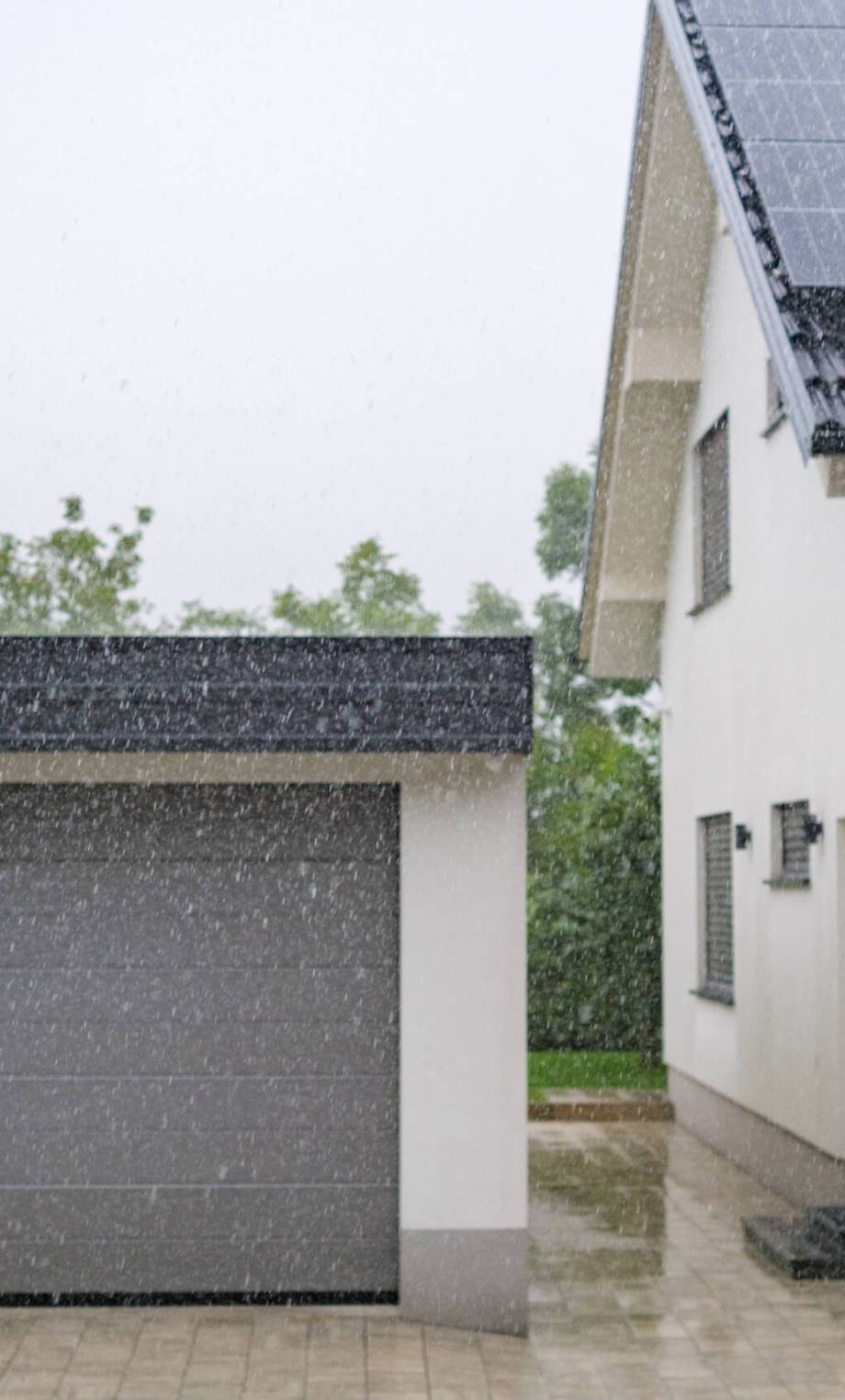 A summer storm, heavy rain in a neighborhood.