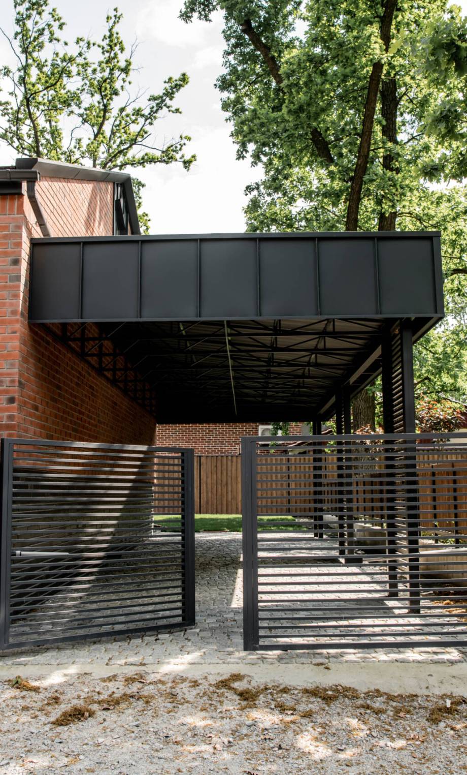 real estate market, brick modern cottage with metal fence and large windows